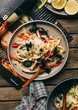 Pasta dish with vegetables on table