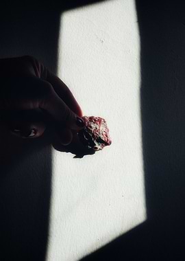 Hand holding a mineral specimen
