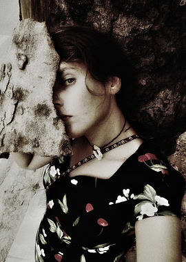 Woman with Floral Dress and Stone