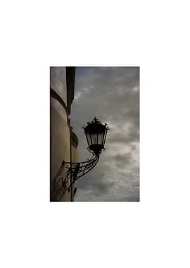 Ornate Street Lamp Against Cloudy Sky