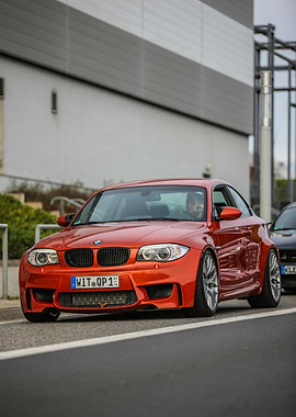 Orange BMW 1M Coupe on Street