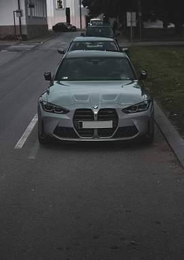 Silver BMW M3 parked on street
