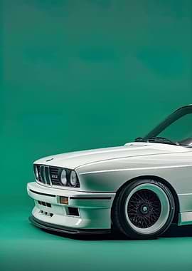 White BMW E30 on Green Background