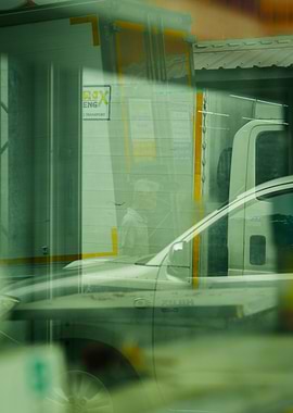 Reflections of a Truck, Car and a man