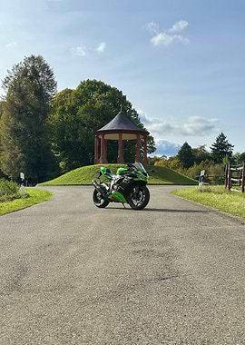 Green and Black Motorcycle on Road