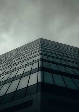 Modern Glass Building Under Cloudy Sky