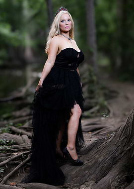 Woman in Black Dress in Forest