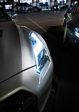 Nissan GTR Headlight Close-Up at Night