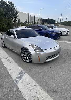Silver Nissan 350Z with other cars