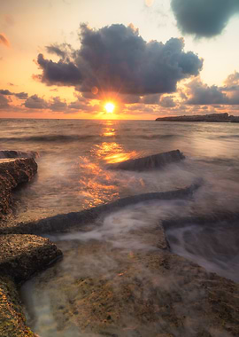 Ocean Sunset with Rocks and Clouds