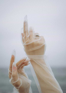 Hands in sheer gloves with ring