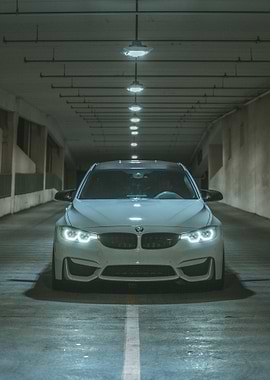 White BMW M3 in Parking Garage