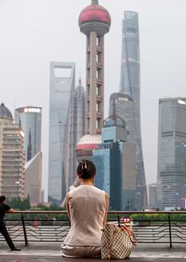 Woman Gazing at Shanghai Skyline