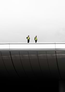 Two Workers on a Modern Chine Building