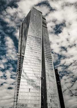Modern Skyscraper Against Cloudy Sky