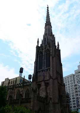 Gothic Church Spire Against Cloudy Sky