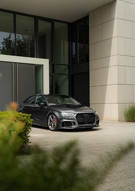 Gray Audi RS3 parked outside building