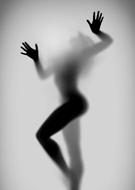 Silhouette of a Woman Behind Glass