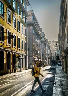 Person Crossing Street in Lisbon, Portugal