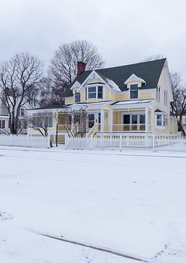 Yellow House in Mackinac Island, Michigan in Winter Landscape