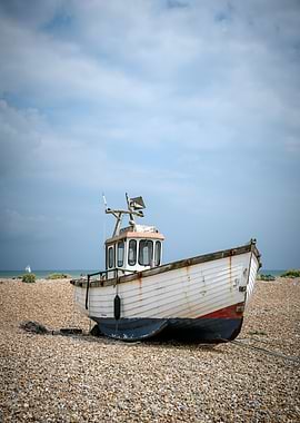 Beached Fishing Boat on Pebble Shore