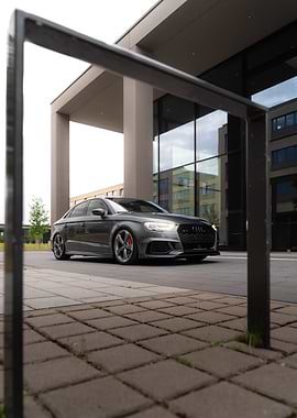 Gray Audi RS3 parked near building