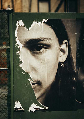 Torn Poster of a Man's Face