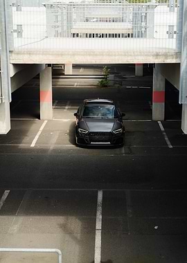 Gray Audi RS3 in Parking Garage
