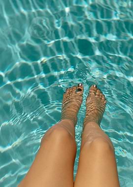 Legs and feet in clear water