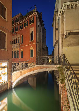 Venice canal and bridge at night