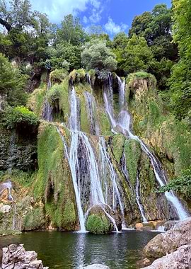 Waterfall cascading down mossy rocks