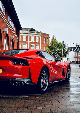 Red Ferrari on Wet Brick Road