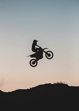 Motocross Rider Silhouette at Sunset