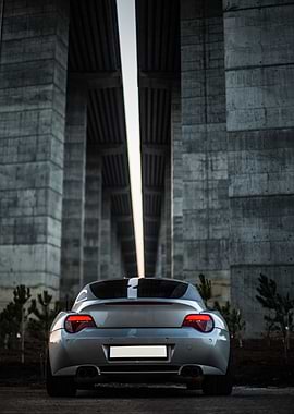 Silver Car Under Concrete Structure