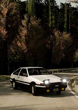 White AE86 on winding road