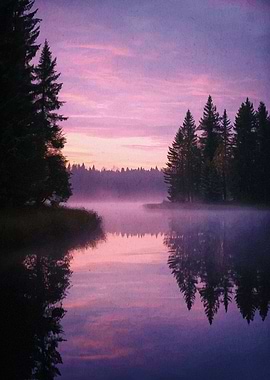 Lake at dawn with forest reflection