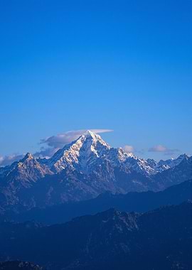 Snowy Mountain Peak Under Blue Sky