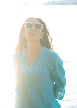 Woman in Sunglasses by the Water