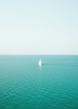 Sailboat on Calm Turquoise Sea
