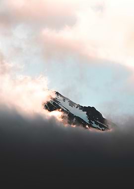 Mountain Peak Emerging from Clouds