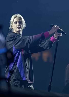 Singer performing on stage with microphone