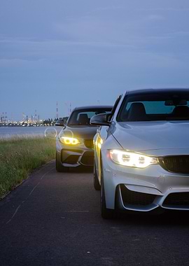 Two Cars Parked by the Water