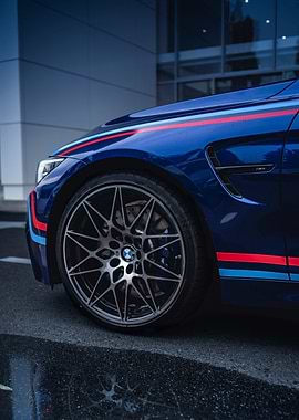 Blue BMW M4 with Racing Stripes