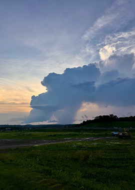 Dramatic Cloudscape over Green Field