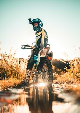 Motocross Rider in Muddy Field