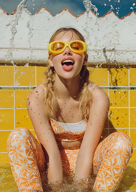 Girl in Pool with Yellow Goggles