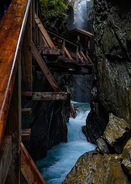 Wooden Bridge Over Turquoise River Gorge | Austria