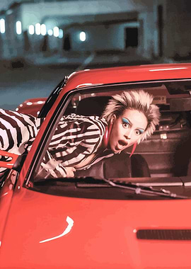 Woman in zebra print in red car