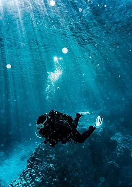 Underwater Scuba Diver in Blue Ocean