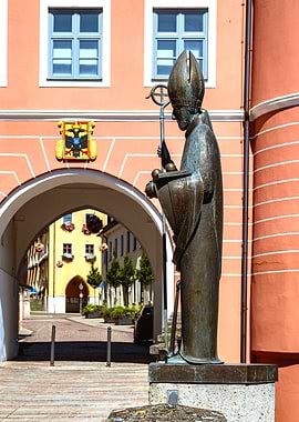 Bronze Statue in Front of Archway